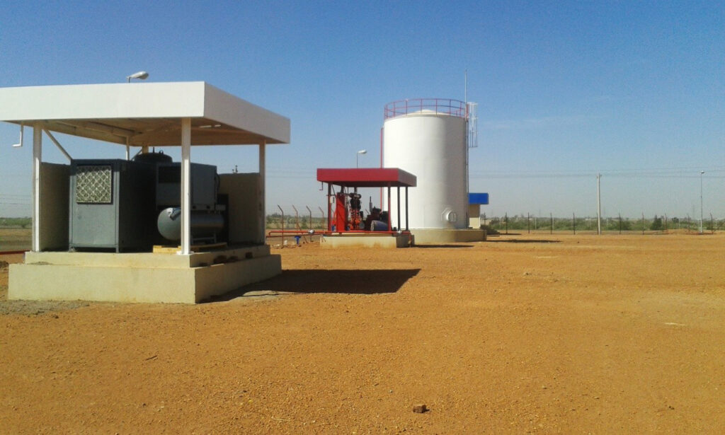 The warehouse's power and support facilities unit features protected electric power generators and fire pumps next to the main water tank to ensure continuity of operations and safety.