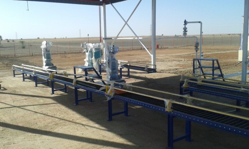 The gas filling platform at the Kosti warehouse during the processing stages, showing semi-automatic filling machines installed on transportation lines in an open working environment that ensures industrial ventilation standards.
