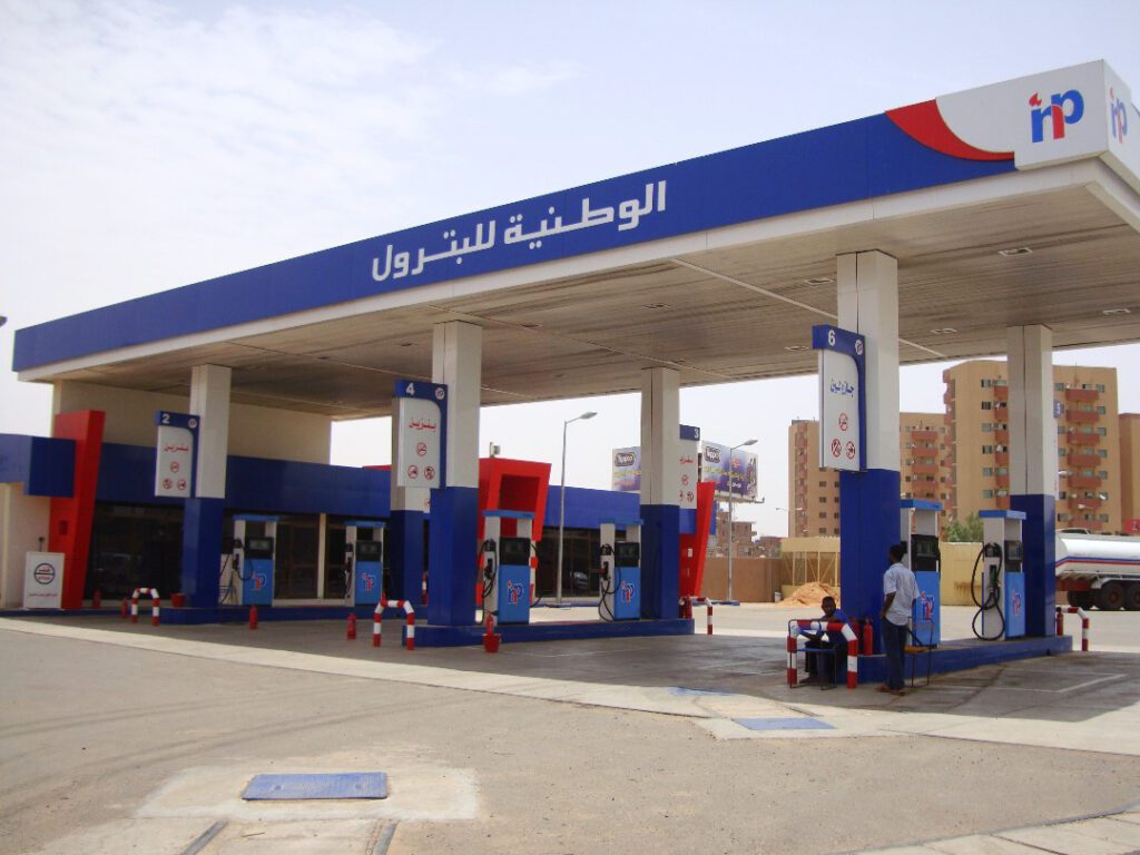 A detailed shot of the fueling area at one of the stations, showing the distribution points designated for gasoline and gasoline with clear signboards to ensure efficient service and customer safety.